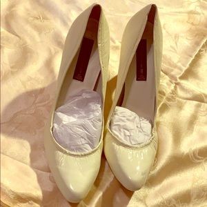 Unworn heels. Size 10. Minor scuff